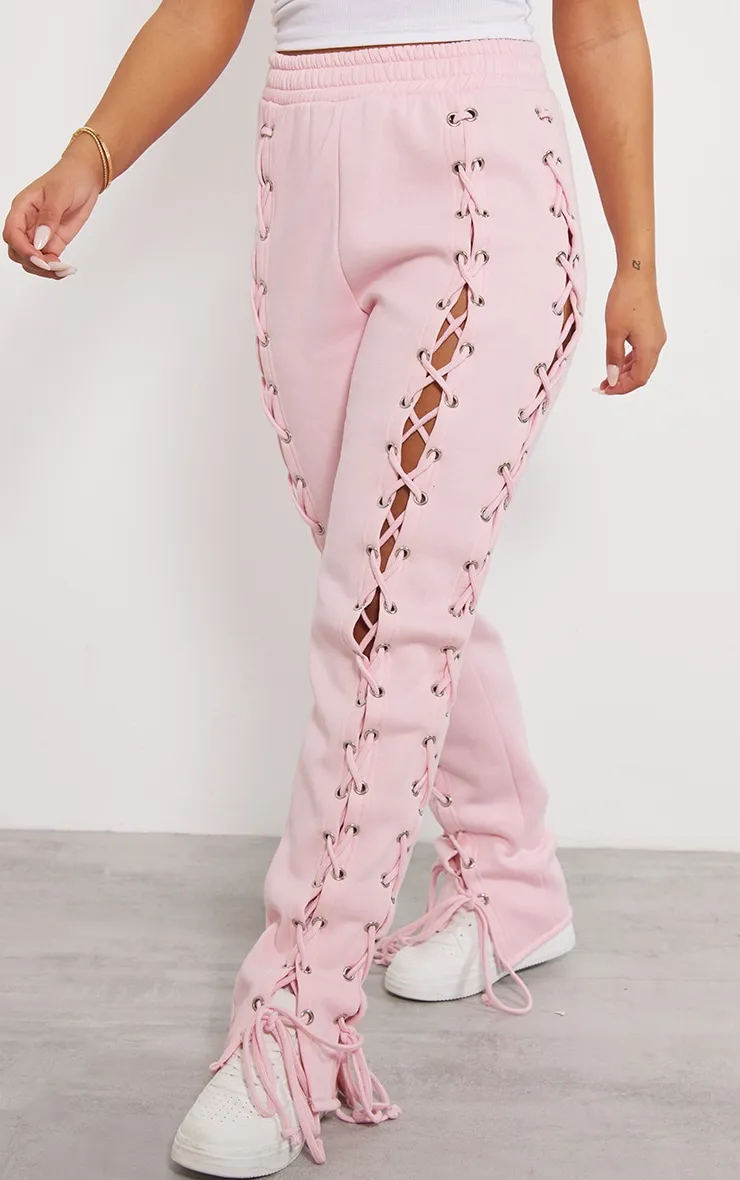 Jogging oversize rose tendre à côtés lacés