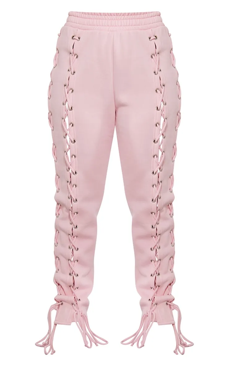 Jogging oversize rose tendre à côtés lacés